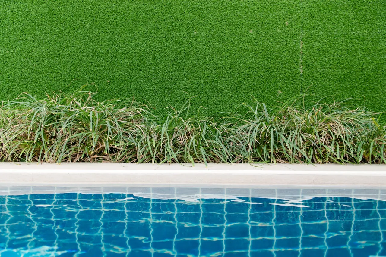 Residential artificial turf installation with neatly trimmed synthetic grass